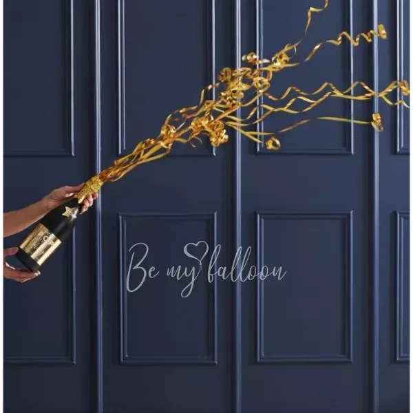 زجاجة الشمبانيا مع القصاصات الملونة