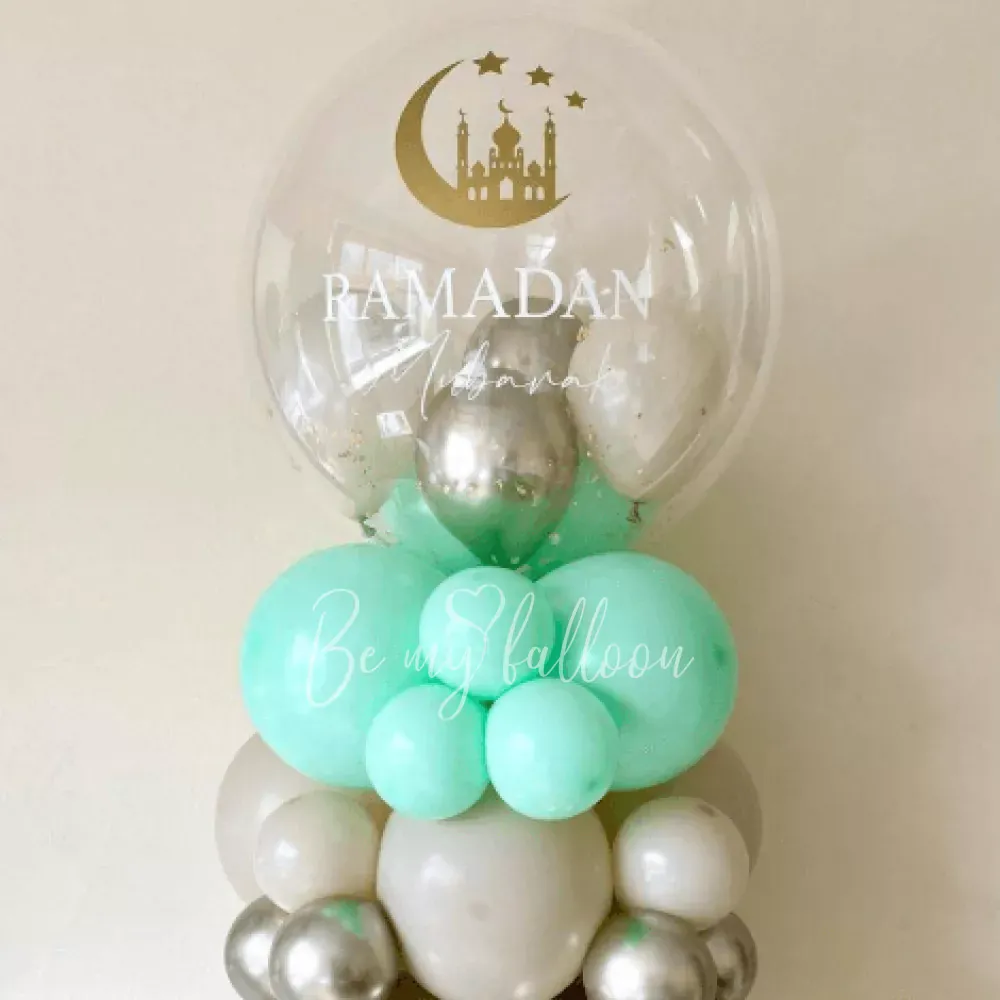 A set of balloons with small mint-green balloons