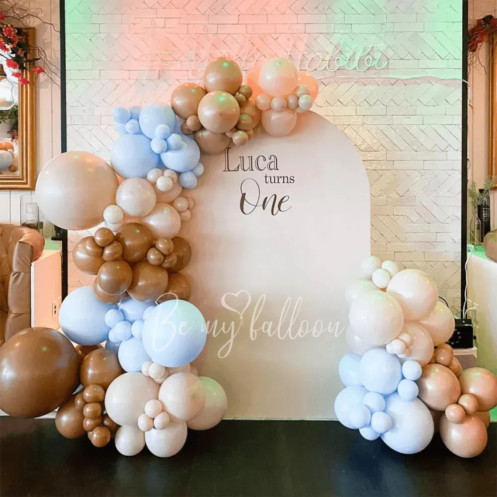 Turns one organic balloon garland with arch backdrop